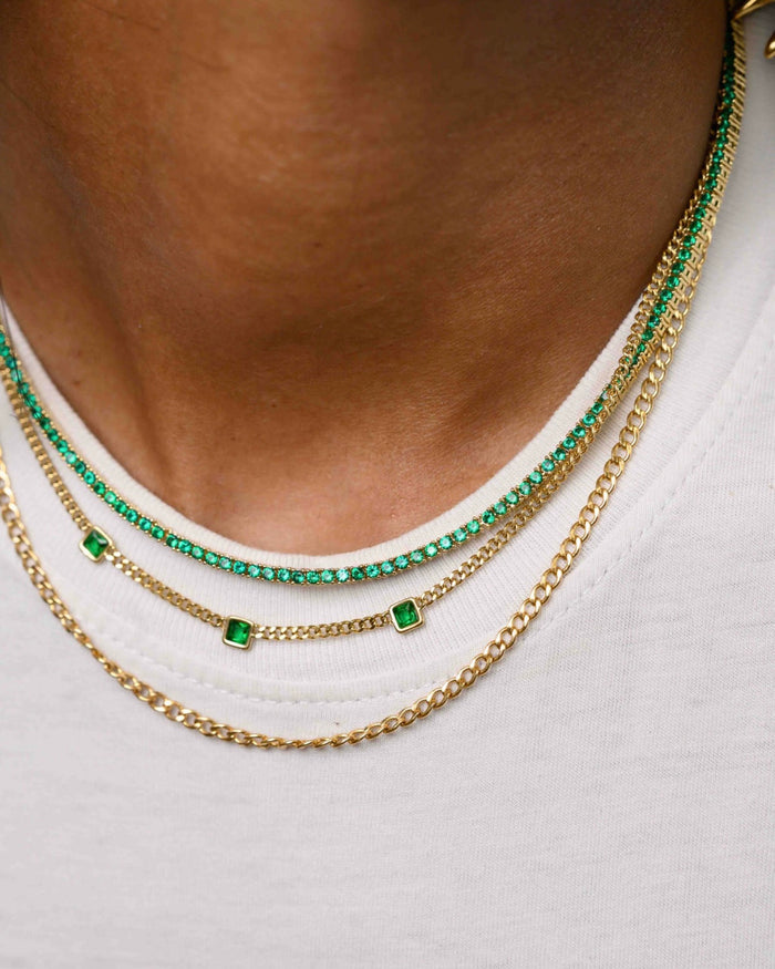 A detail view of the gold Emerald Everyday tennis necklace by Beads by Tara