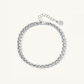 Close up of silver bracelet on a white background
