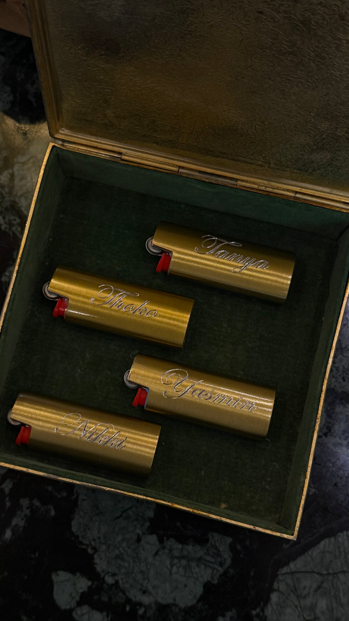 Engraved lighter cover with a polished gold finish, sized for a BIC mini lighter