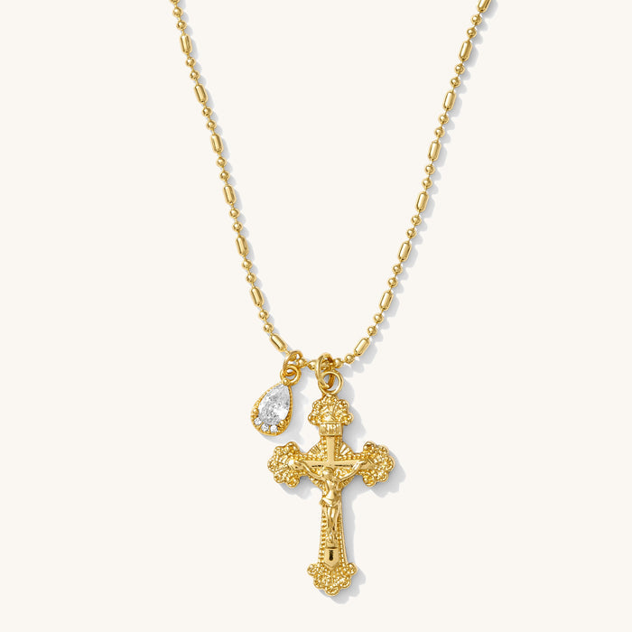 Ernestina necklace in 14k gold vermeil with an ornate cross and pear-cut gem