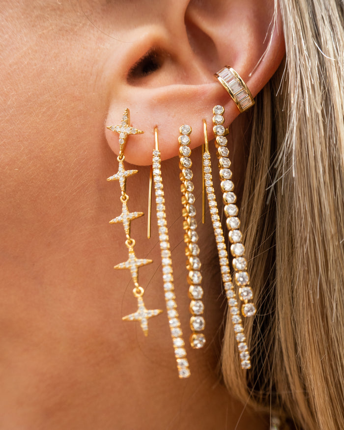 Model wearing the sparkling Eve ear cuff curved along the outer ear