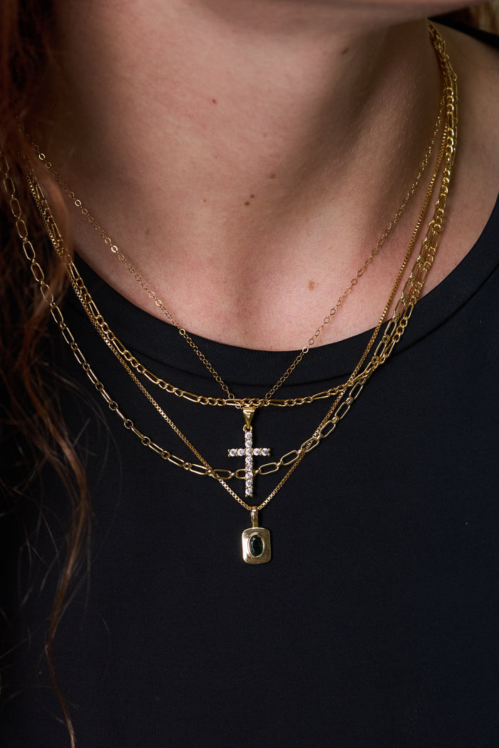 The gold-filled Everyday Cross necklace, a classic silhouette made for layering