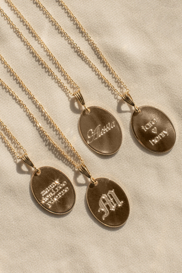 Elongated oval Fiona pendant on a dainty chain ready for engraving