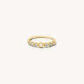 Close up of the gold Fleur de Sel pearl ring on a white background