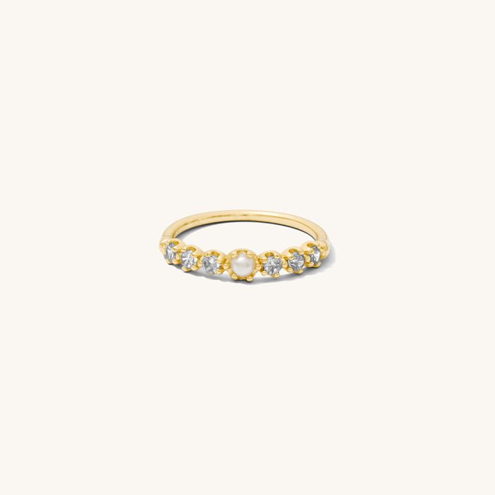 Close up of the gold Fleur de Sel pearl ring on a white background