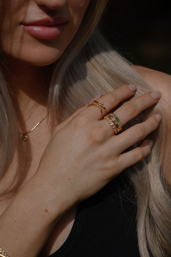 Close view of the gold Fleur de Sel pearl ring on a white background
