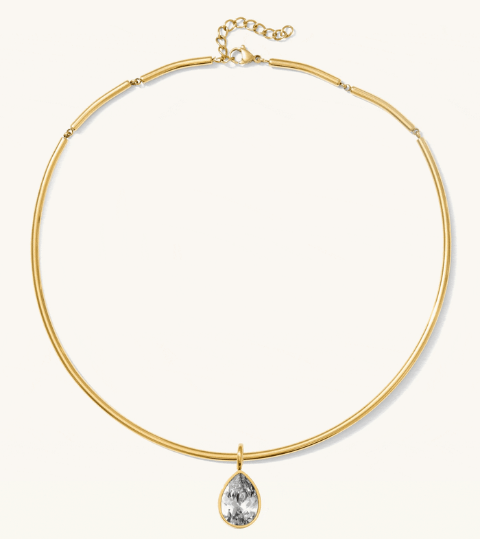 Gold Frankie collar necklace shown with its interchangeable stone pendants