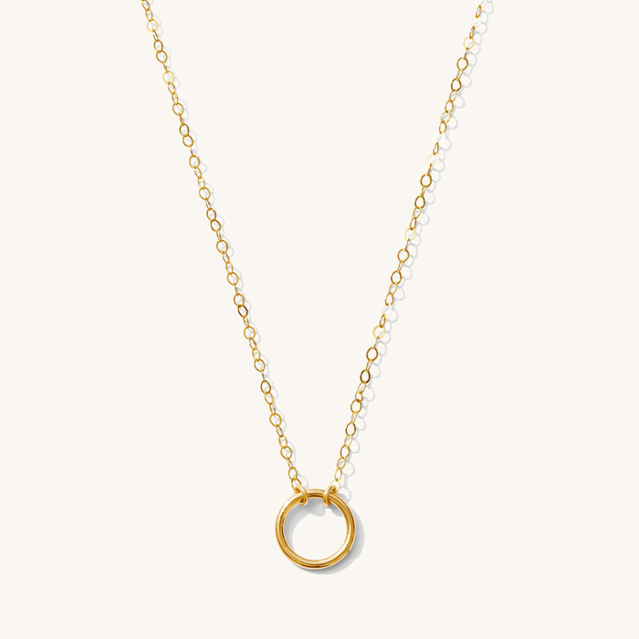 Close up of the Full Circle pendant necklace on a white background