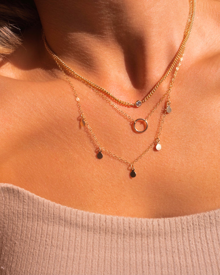 Full Circle necklace styled on the neckline as an everyday piece