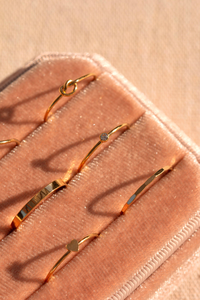 Hammered gold-filled band styled with other dainty stacking rings