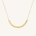 Close up of the gold Hannah flat chain necklace on a white background