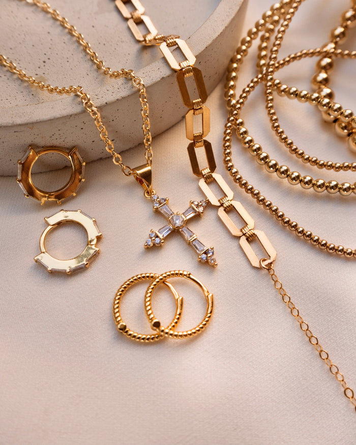 Hannah flat chain necklace worn layered with dainty gold chains