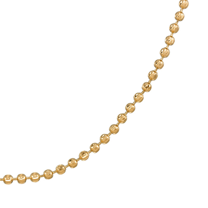 Gold Harley ball chain necklace styled on the neckline with a low cut top