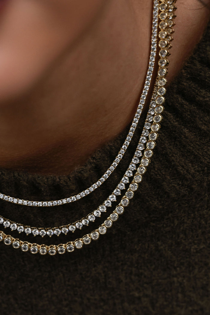 Gold tennis necklace lined with brilliant-cut crystal stones by Beads by Tara