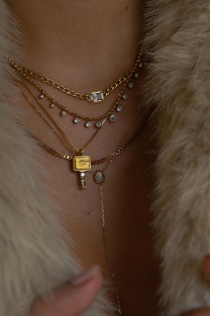 Gold Heirloom Key necklace featuring a pave crystal key pendant