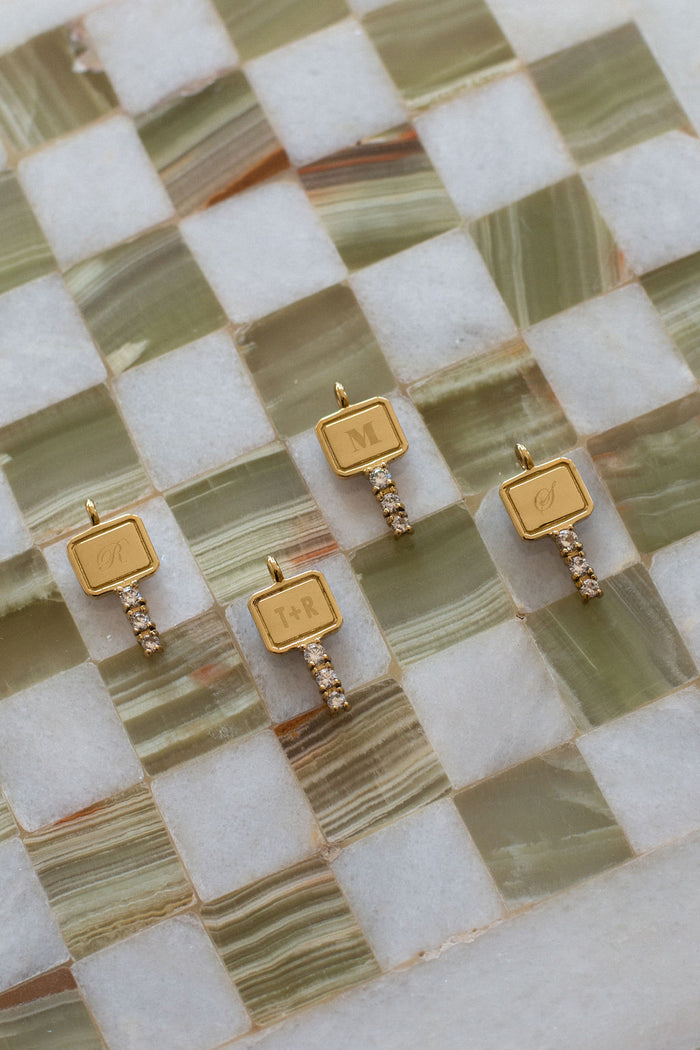 Personalized gold key necklace with an adjustable extender chain