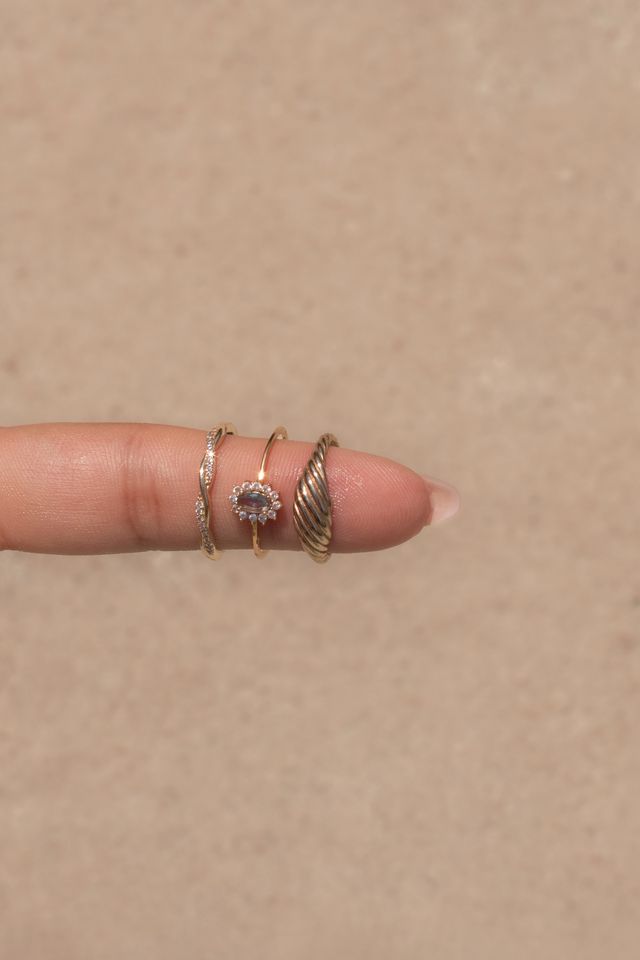 Twisted gold band of the Infinity Twist ring set with sparkling CZ stones