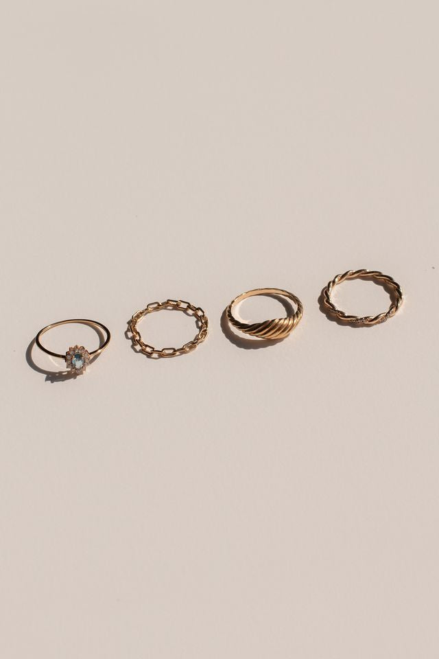 Close view of the crystal-set twist detail on the gold Infinity Twist ring