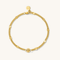 Close up of gold bracelet with initial beads