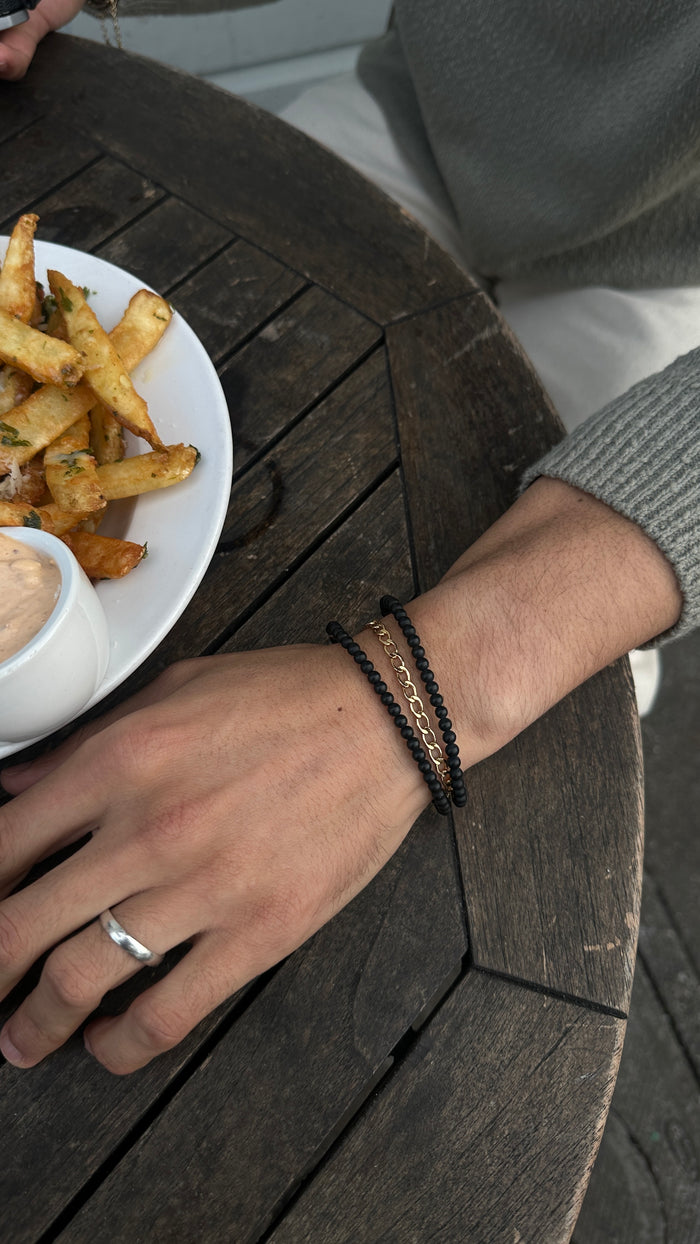 Matte onyx JC bracelet with a silver accent bead by Beads by Tara