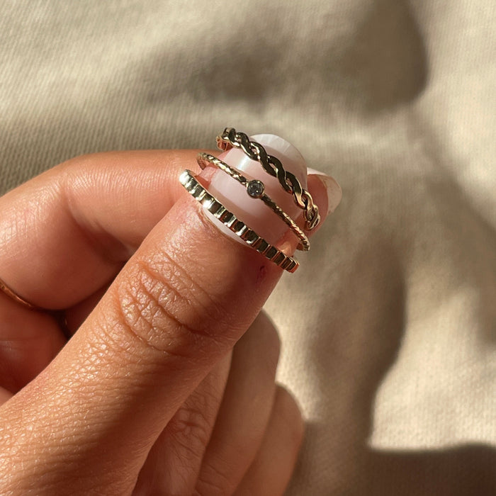 Gold fill Jessi accent ring with a hammered finish on a classic band
