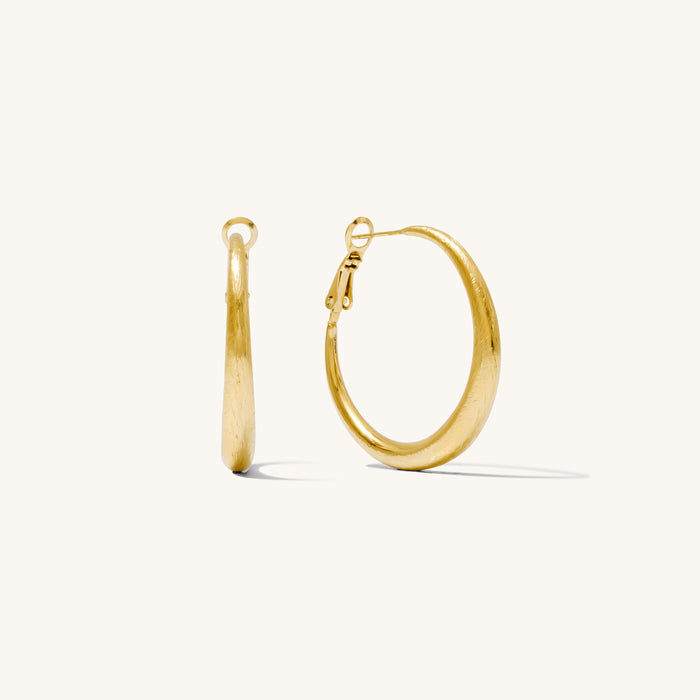 Close up shot of hoop earrings on a white background