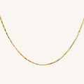 Close up of the gold Joy square link necklace on a white background