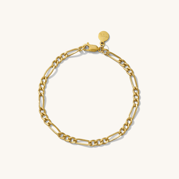 Close up of a gold chain bracelet on a white background