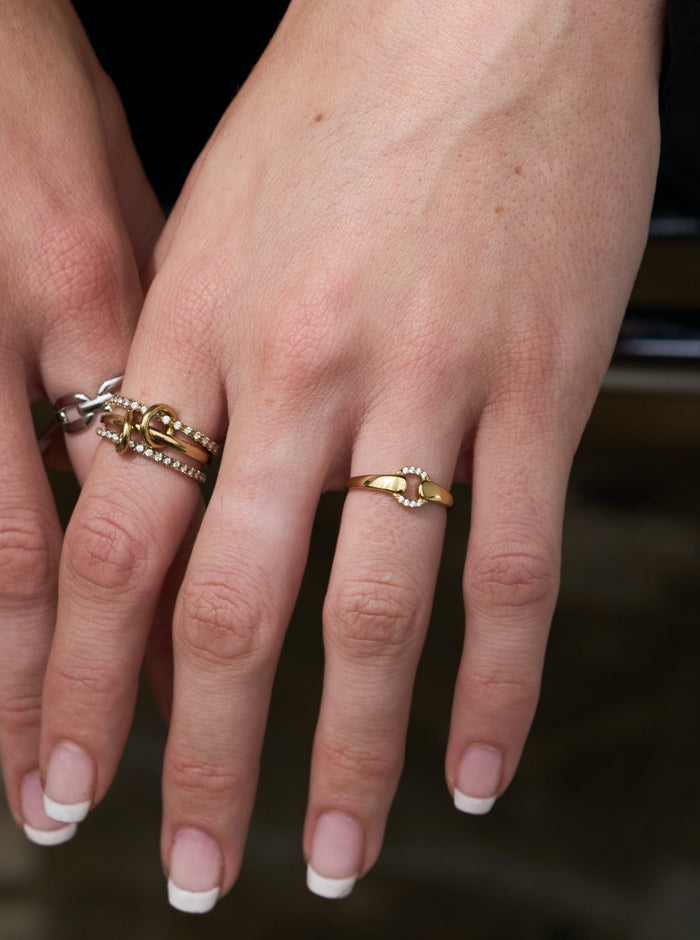 The Karma ring joining a simple gold band to a stone-encrusted circle