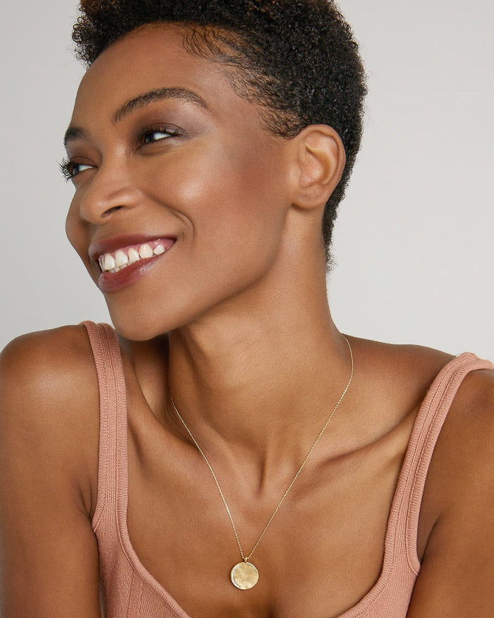Model wearing Keep Dreaming Necklace in 14k gold finish