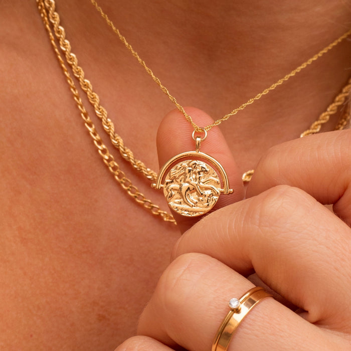 Close up of a neckline wearing the gold-filled Lady G coin necklace