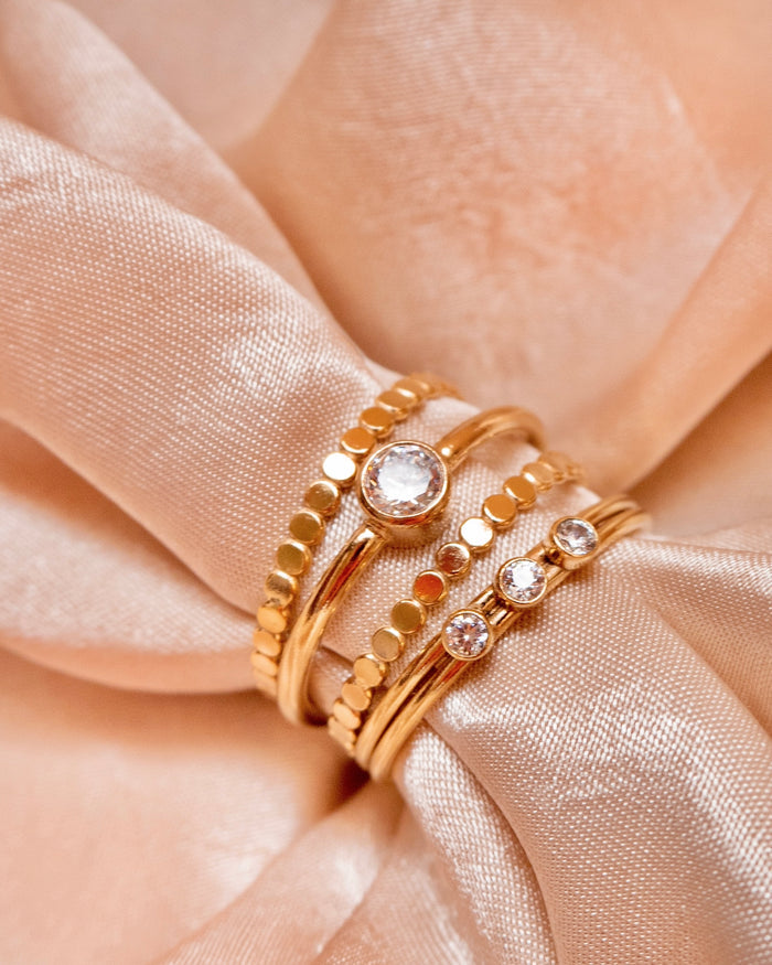 Close up of the Laguna ring stacked with dainty gold-filled bands
