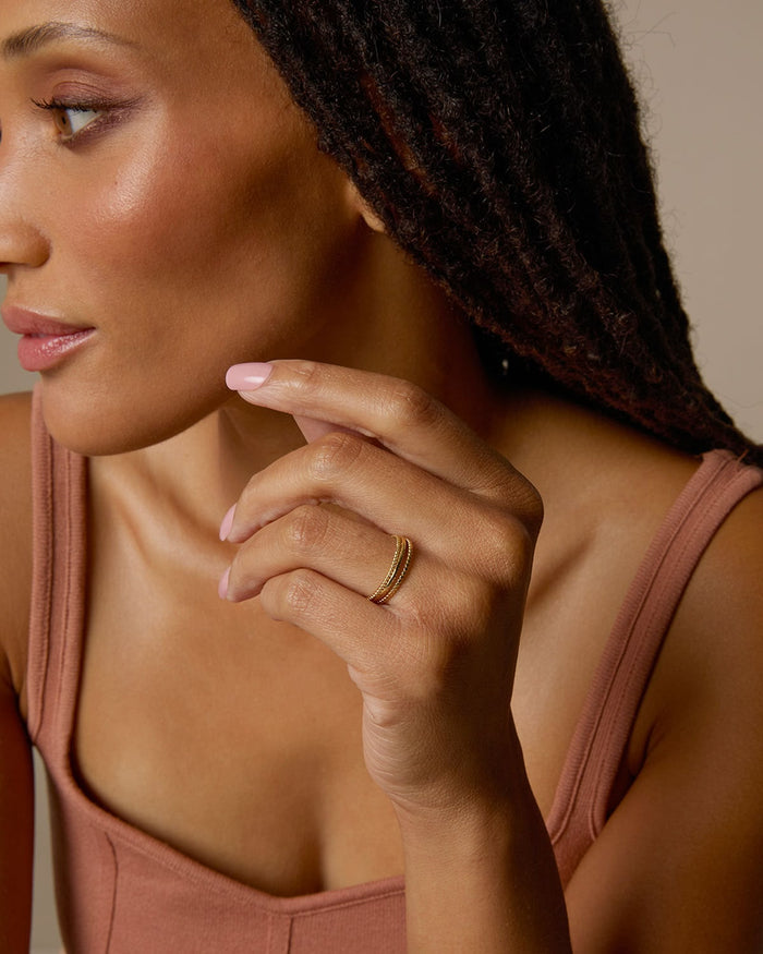 Bryan Anthonys Layers of You Ring Stack Aligned Entwined and Simplicity Rings in Gold On Model