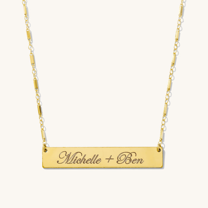 The Lennon bar necklace, a longer engravable bar in 14k gold fill