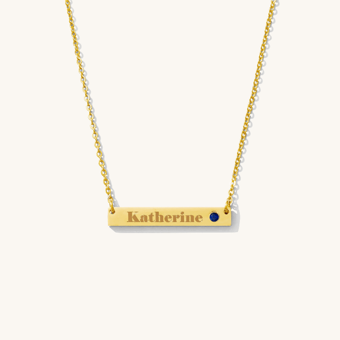The Lennon Birthstone necklace with an engravable bar and a pave crystal