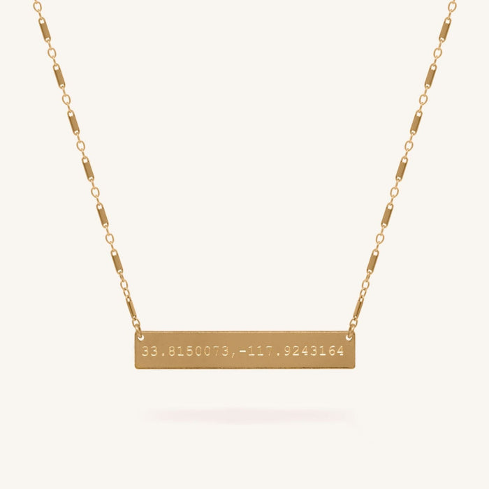 Lennon coordinate necklace engraved with custom latitude and longitude