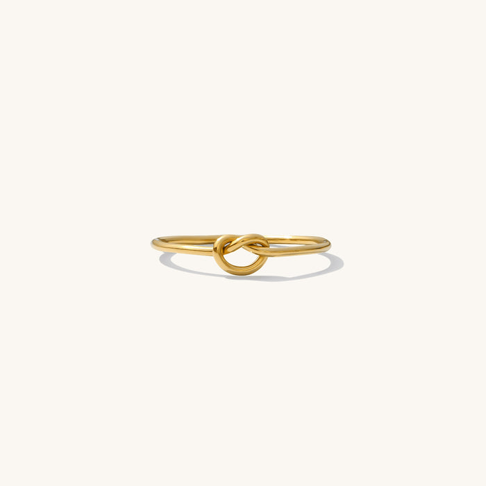 Love Me Knot ring, a dainty gold-filled band wrapped into a small knot