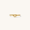 Love Me Knot ring, a dainty gold-filled band wrapped into a small knot