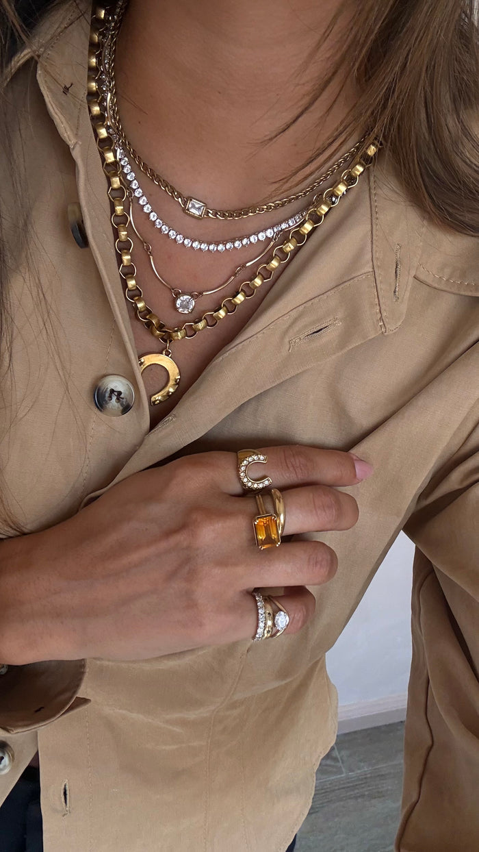 Lucky Me necklace pairing a bold vintage-feel gold chain with a horseshoe pendant