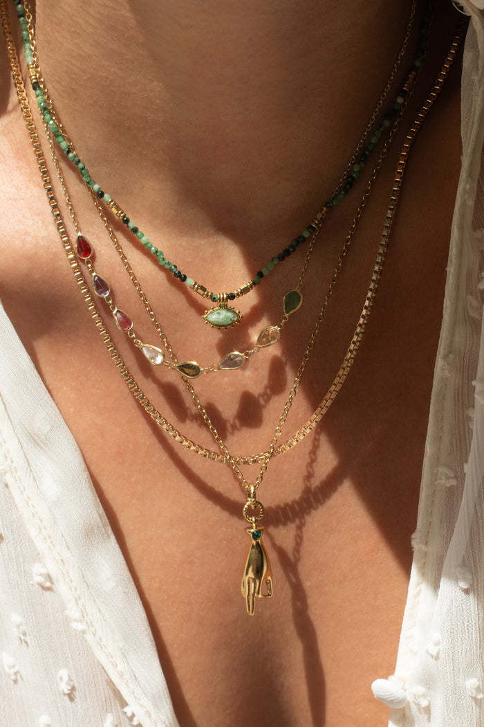 The Lyla necklace styled and layered with other dainty summer necklaces