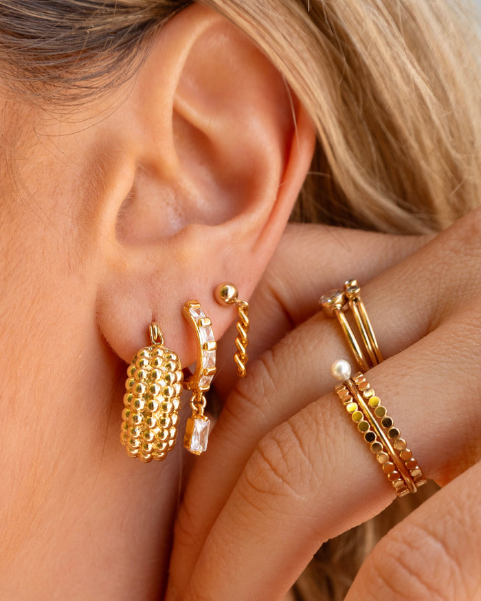 Maldives pearl ring shown with dainty stud and hoop earring stacks