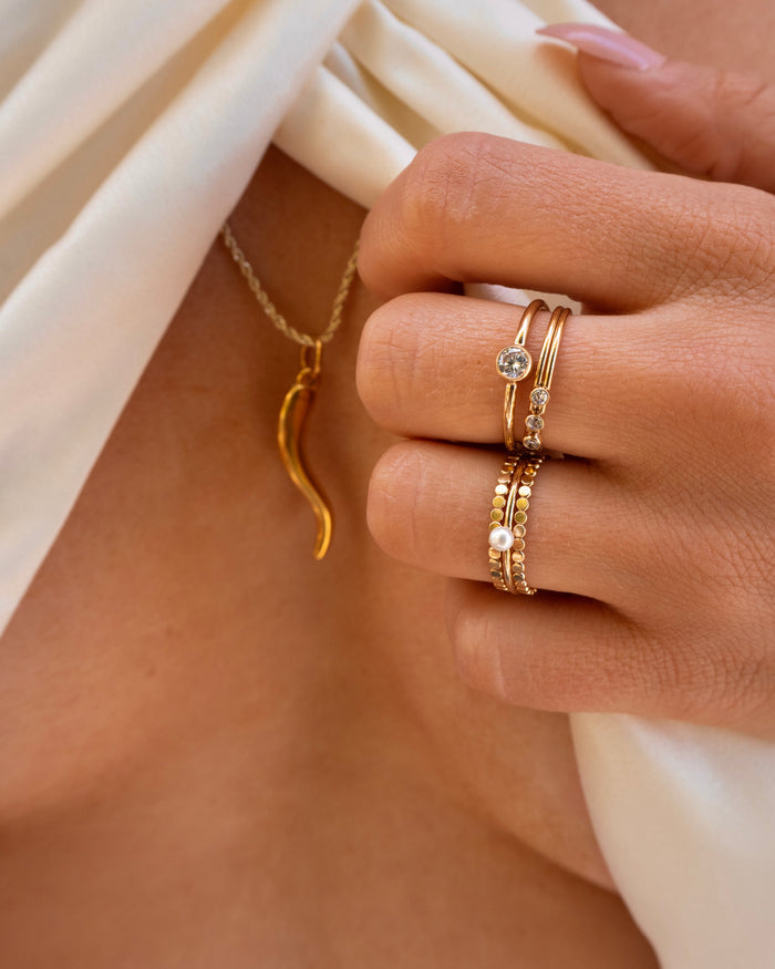 Gold-filled Maldives petite pearl ring layered in a stacking ring set