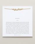 Mamá Necklace (Spanish) on card