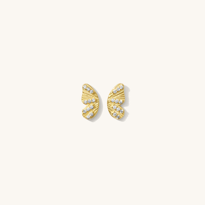 Close up of the gold Mariposa butterfly stud earrings on a white background