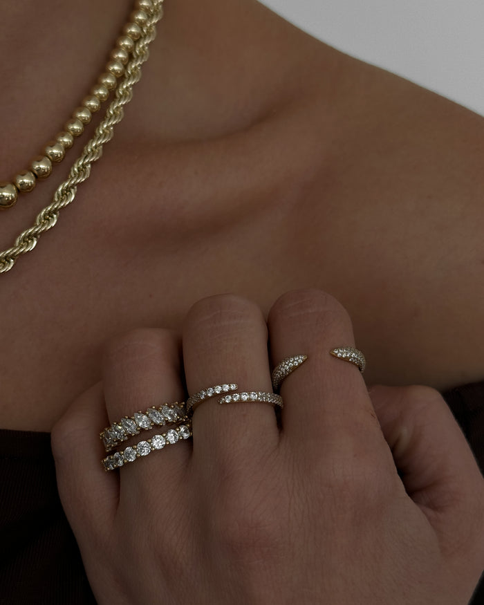 Model wearing the gold Markie marquise ring from Beads by Tara