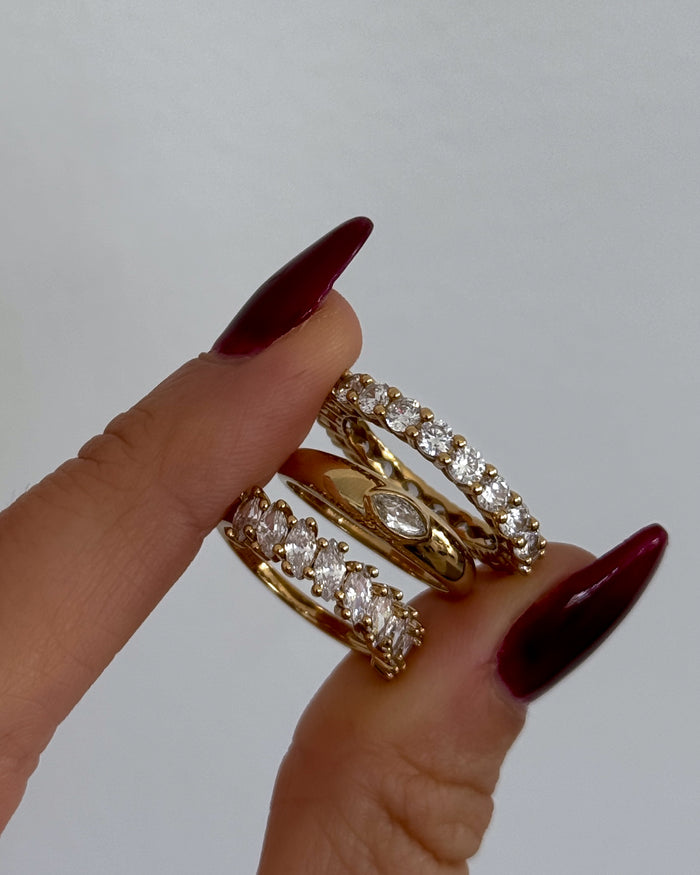A model wearing the gold Markie marquise ring in a Beads by Tara campaign image