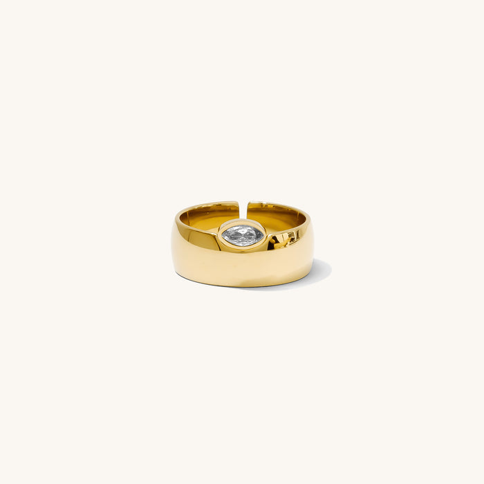 Close up of the gold Marquise cigar band ring on a white background