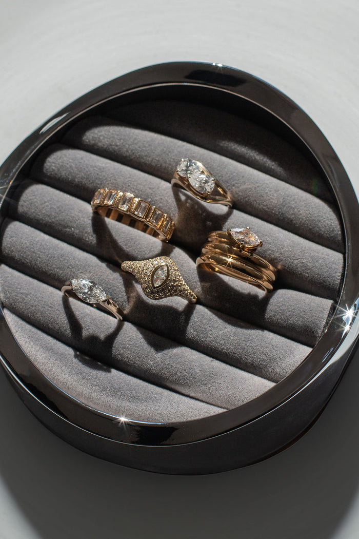 Marquise cut white topaz set in a corner bezel gold pinky ring