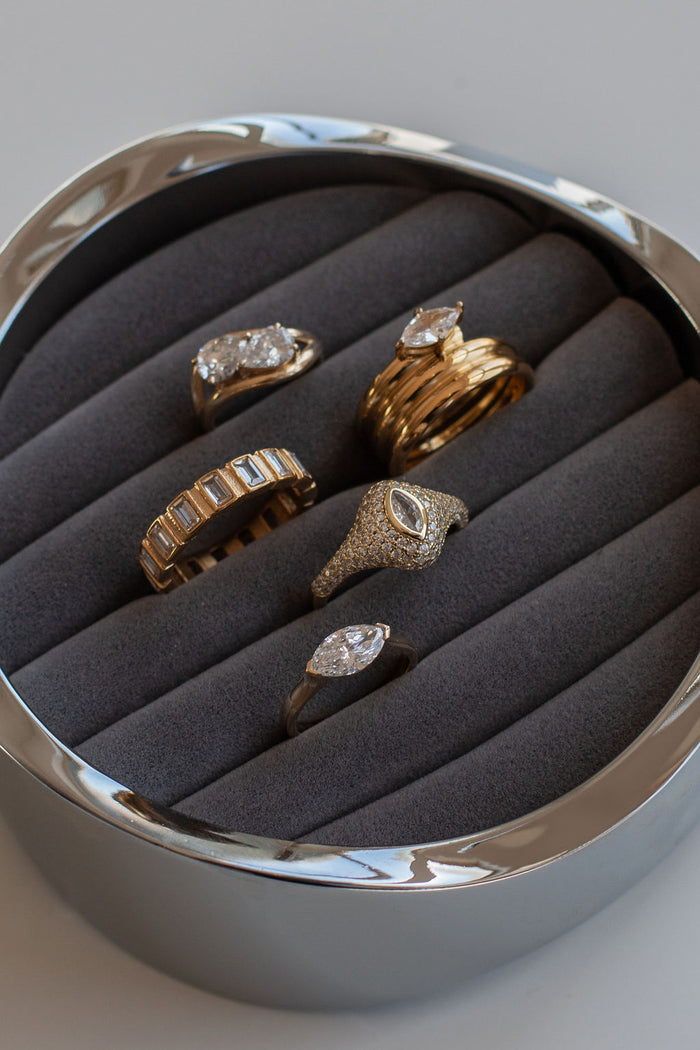 The gold Marquise pinky ring with an elongated bezel set stone