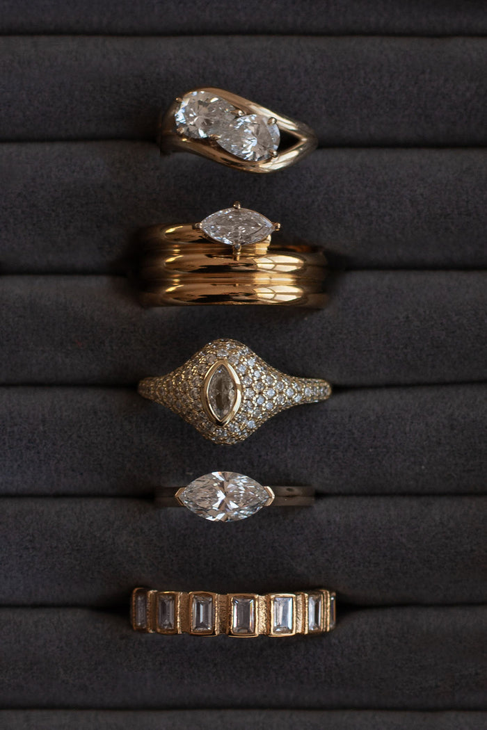 Slim gold vermeil pinky ring with a marquise white topaz centerpiece